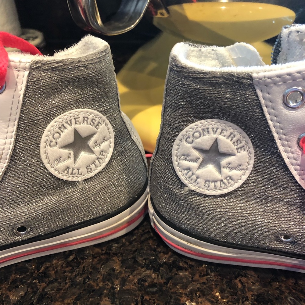 High top, silver and white Converse sneakers